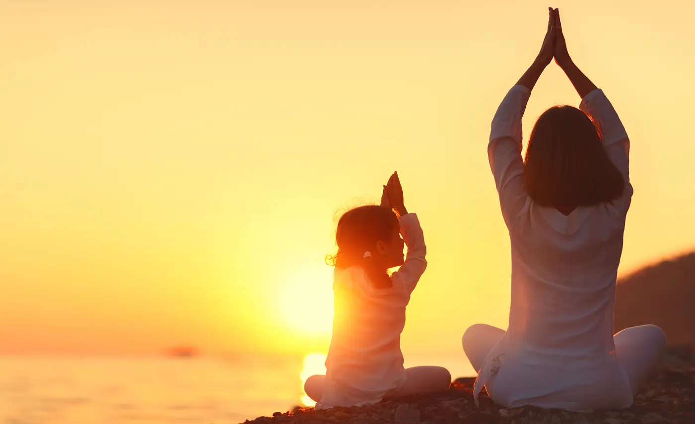 Mother and Daughter meditating